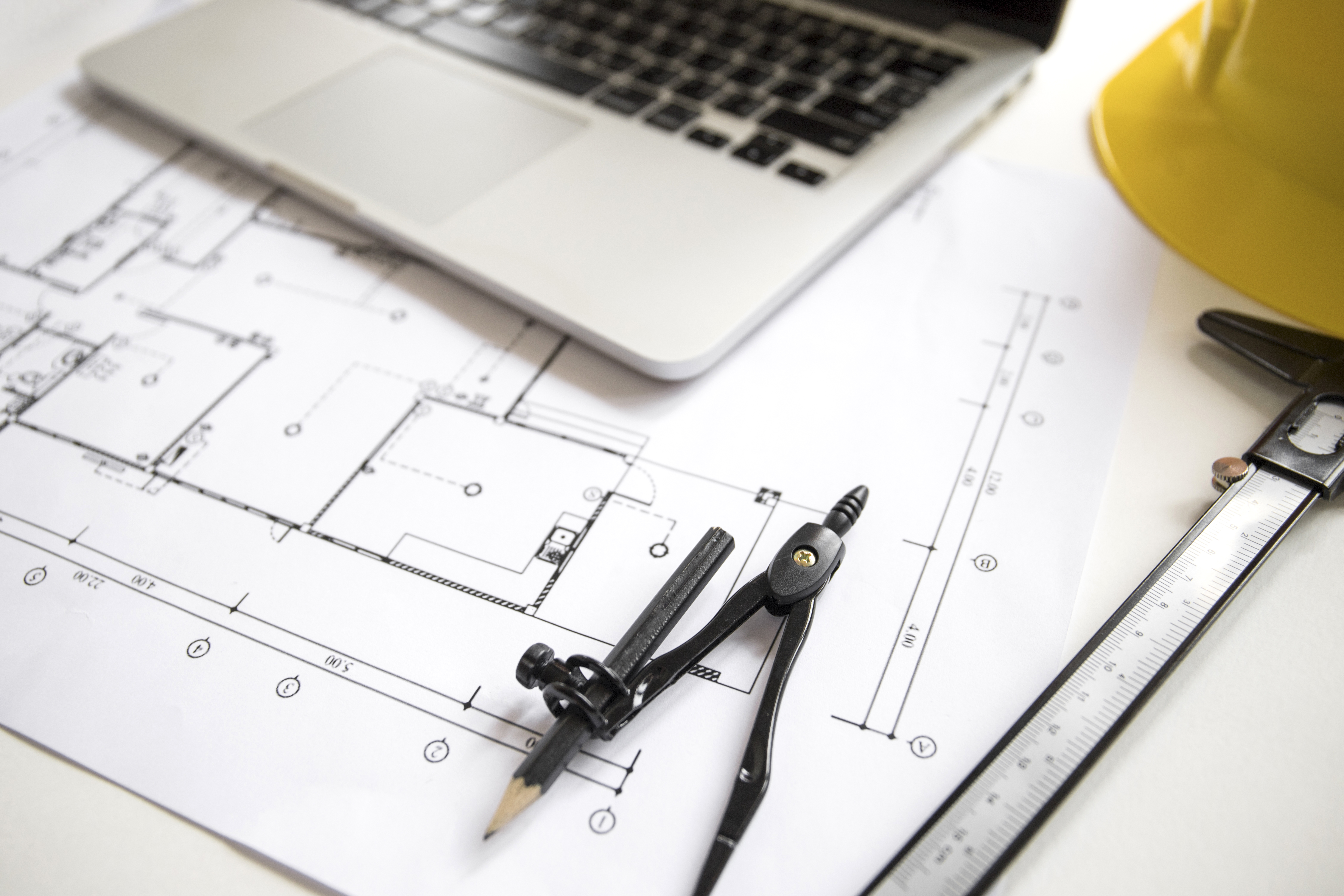 compasses-near-laptop-plan